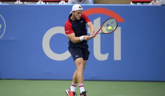 Denis Kudla returns a shot against Feliciano Lopez, of Spain, during a match in the Citi Open tennis tournament, Tuesday, Aug. 3, 2021, in Washington. (AP Photo/Nick Wass)