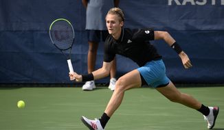 Sebastian Korda chases down the ball against Vasek Pospisil, of Canada, during a match in the Citi Open tennis tournament, Tuesday, Aug. 3, 2021, in Washington. (AP Photo/Nick Wass) **FILE**