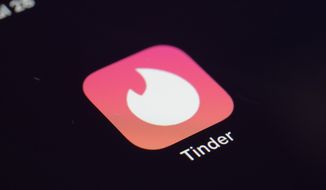 This Tuesday, July 28, 2020, file photo shows the icon for the Tinder dating app on a device in New York. (AP Photo/Patrick Sison, File)