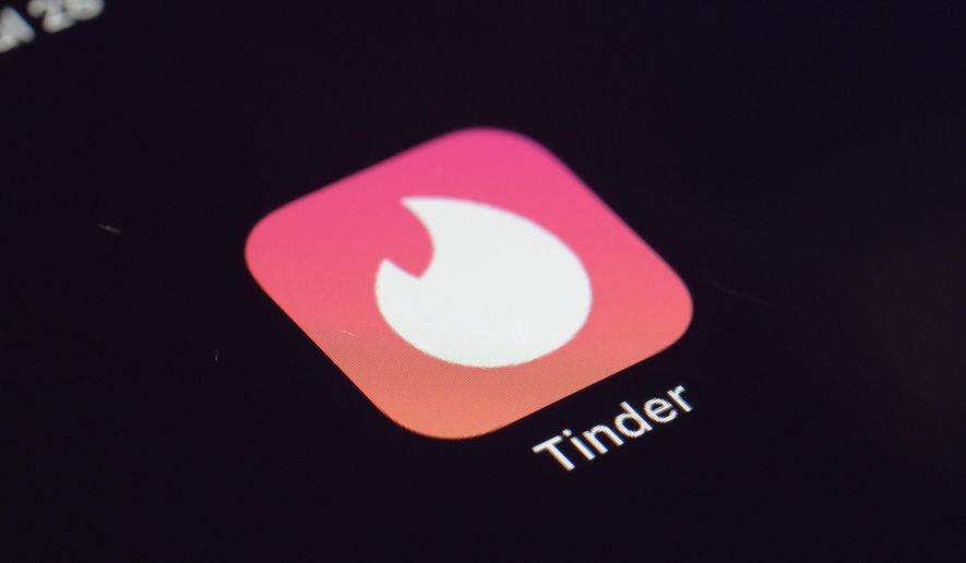This Tuesday, July 28, 2020, file photo shows the icon for the Tinder dating app on a device in New York. (AP Photo/Patrick Sison, File)
