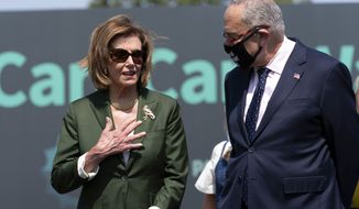 Speaker of the House Nancy Pelosi, D-Calif., speaks with Senate Majority Leader Chuck Schumer, D-N.Y., during Paid Leave for All rally on Capitol Hill in Washington, Wednesday, Aug. 4, 2021. (AP Photo/Jose Luis Magana) ** FILE **