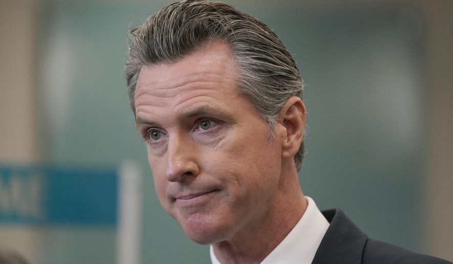 In this July 26, 2021, file photo, California Gov. Gavin Newsom appears at a news conference in Oakland, Calif. The Orange County Board of Education in Southern California announced plans to sue Newsom over a state mandate requiring K-12 students to wear masks in classrooms. (AP Photo/Jeff Chiu, File)