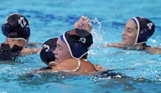 United States&#39; Melissa Seidemann (3) and Aria Fischer (9) celebrate after a win against the Russian Olympic Committee in a semifinal round women&#39;s water polo match at the 2020 Summer Olympics, Thursday, Aug. 5, 2021, in Tokyo, Japan. (AP Photo/Mark Humphrey)