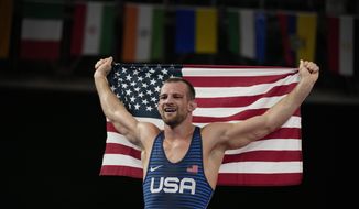 United States&#39; David Morris Taylor III celebrates holding the US flag after winning the gold medal in the men&#39;s 86kg Freestyle wrestling event at the 2020 Summer Olympics, Thursday, Aug. 5, 2021, in Tokyo, Japan. (AP Photo/Aaron Favila)
