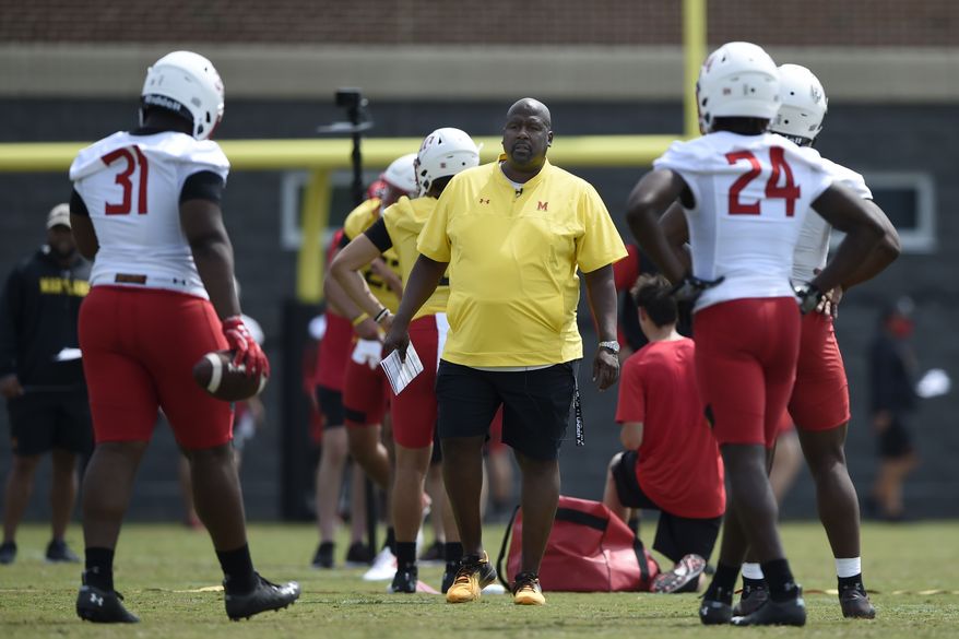 Maryland football head coach Michael Locksley looks on during NCAA college football practice, Friday, Aug. 6, 2021, in College Park, Md.(AP Photo/Gail Burton) **FILE**