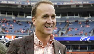 FILE - In this Nov. 4, 2018 file photo, former Denver Broncos quarterback Peyton manning talks prior to an NFL football game between the Denver Broncos and the Houston Texans in Denver.  The roster of men entering the Pro Football Hall of Fame this weekend of Saturday, Aug. 7, 2021, features everything from the prolific passer, to the dominant defender,  and not to mention coaches.   (AP Photo/Jack Dempsey, File)