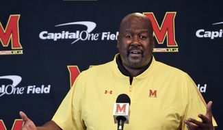 Maryland head coach Michael Locksley answers questions from reporters during an NCAA college football media day, Friday, Aug. 6, 2021, in College Park, Md. (AP Photo/Gail Burton) **FILE**