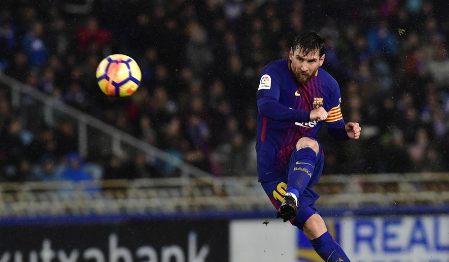In this Jan.14, 2018 file photo FC Barcelona&#39;s Lionel Messi kicks the ball and scores the fourth goal of his team against Real Sociedad during the Spanish La Liga soccer match between Barcelona and Real Sociedad, at Anoeta stadium, in San Sebastian, northern Spain. Barcelona announced Thursday Aug. 5, 2021 that Lionel Messi will not stay with the club. He is leaving after 17 successful seasons in which he propelled the Catalan club to glory, helping it win numerous domestic and international titles since debuting as a teenager. (AP Photo/Alvaro Barrientos, File) **FILE**