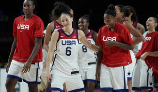 United States&#39; Sue Bird (6) and teammates celebrate after their win in the women&#39;s basketball semifinal game against Serbia at the 2020 Summer Olympics, Friday, Aug. 6, 2021, in Saitama, Japan. (AP Photo/Charlie Neibergall)