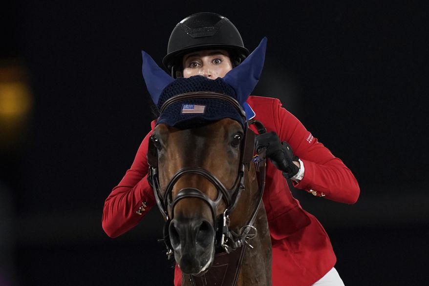United States&#39; Jessica Springsteen, riding Don Juan van de Donkhoeve, competes during the equestrian jumping team qualifying at Equestrian Park in Tokyo at the 2020 Summer Olympics, Friday, Aug. 6, 2021, in Tokyo, Japan. (AP Photo/Carolyn Kaster)
