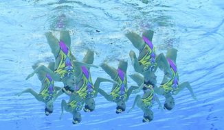 The Italy artistic swimming team competes during the team technical routine at the 2020 Summer Olympics, Friday, Aug. 6, 2021, in Tokyo, Japan. (AP Photo/Morry Gash)