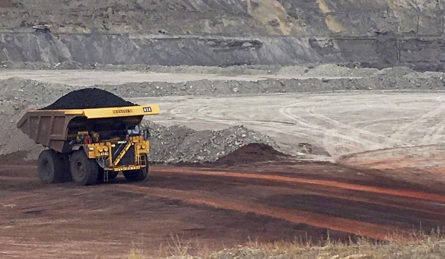 In this March 28, 2017, file photo, a dump truck hauls coal at Contura Energy&#x27;s Eagle Butte Mine near Gillette, Wyo. (AP Photo/Mead Gruver) ** FILE **