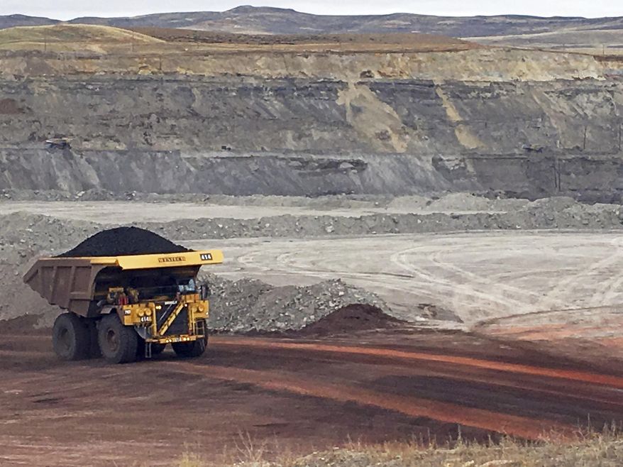 In this March 28, 2017, file photo, a dump truck hauls coal at Contura Energy&#39;s Eagle Butte Mine near Gillette, Wyo. (AP Photo/Mead Gruver) ** FILE **