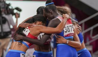 The team from the United States wins the women&#39;s 4 x 400-meter relay at the 2020 Summer Olympics, Saturday, Aug. 7, 2021, in Tokyo. (AP Photo/Matthias Schrader)