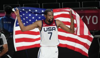 United States&#x27; Kevin Durant (7) celebrates after their win in the men&#x27;s basketball gold medal game against France at the 2020 Summer Olympics, Saturday, Aug. 7, 2021, in Saitama, Japan. (AP Photo/Luca Bruno)