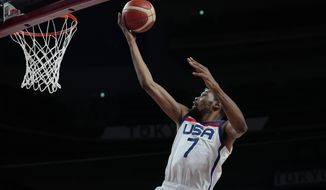 United States&#39; Kevin Durant (7) scores during men&#39;s basketball gold medal game against France at the 2020 Summer Olympics, Saturday, Aug. 7, 2021, in Saitama, Japan. (AP Photo/Eric Gay)