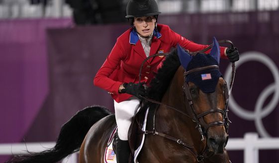 United States&#39; Jessica Springsteen, riding Don Juan van de Donkhoeve, competes in a jump-off during the equestrian jumping team final at Equestrian Park in Tokyo at the 2020 Summer Olympics, Saturday, Aug. 7, 2021, in Tokyo, Japan. (AP Photo/Carolyn Kaster)