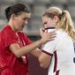 Team Canada forward Christine Sinclair, left, consoles Team United States midfielder Lindsey Horan (9) after their semifinal soccer match at the Tokyo Olympics in Kashima, Japan, Monday, Aug. 2, 2020. Canada won 1-0. (Frank Gunn/The Canadian Press via AP)