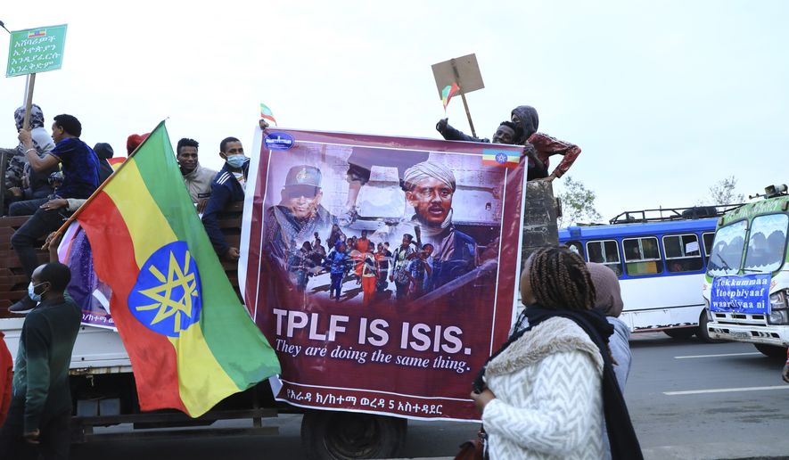Thousands of Ethiopian from the capital, Addis Ababa and the environs are flocking to Meskel Square, Sunday, Aug. 8, 2021, to rally against the TPLF under the motto "I march to Save Ethiopia" and renew committment to support the national army. Horsemen from towns and villages of the outskirts of Addis Ababa and Finfine Special zone are riding to the most famous public Square saying slogans denouncing the TPLF atrocities and praising bravery of the troops of the Ethiopian National Defence Forces (ENDF). (AP Photo)
