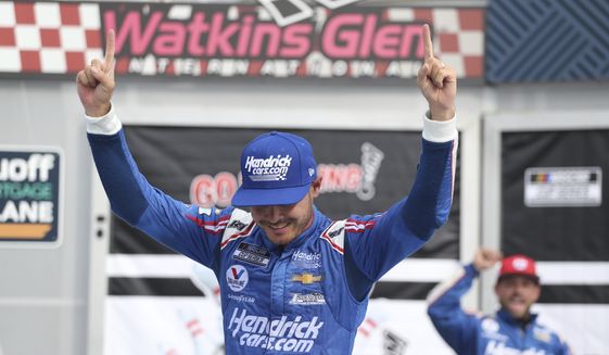 Kyle Larson celebrates winning a NASCAR Cup Series auto race in Watkins Glen, N.Y., on Sunday, Aug. 8, 2021. (AP Photo/Joshua Bessex)