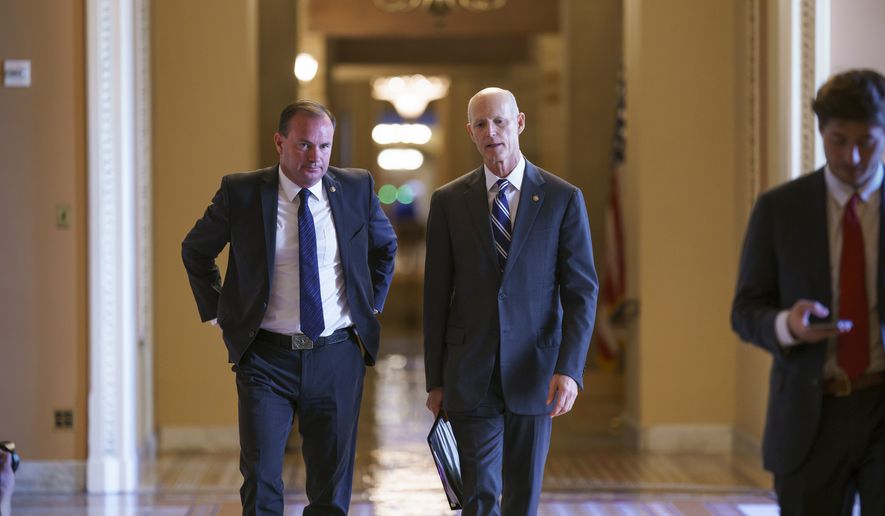 Sen. Mike Lee, R-Utah, left, and Sen. Rick Scott, R-Fla., leave a meeting in the office of Senate Minority Leader Mitch McConnell, R-Ky., as a coalition of Democrats and Republicans push the $1 trillion bipartisan infrastructure package closer to passage despite a few holdouts trying to derail one of President Joe Biden&#39;s top priorities, at the Capitol in Washington, Monday, Aug. 9, 2021. (AP Photo/J. Scott Applewhite)