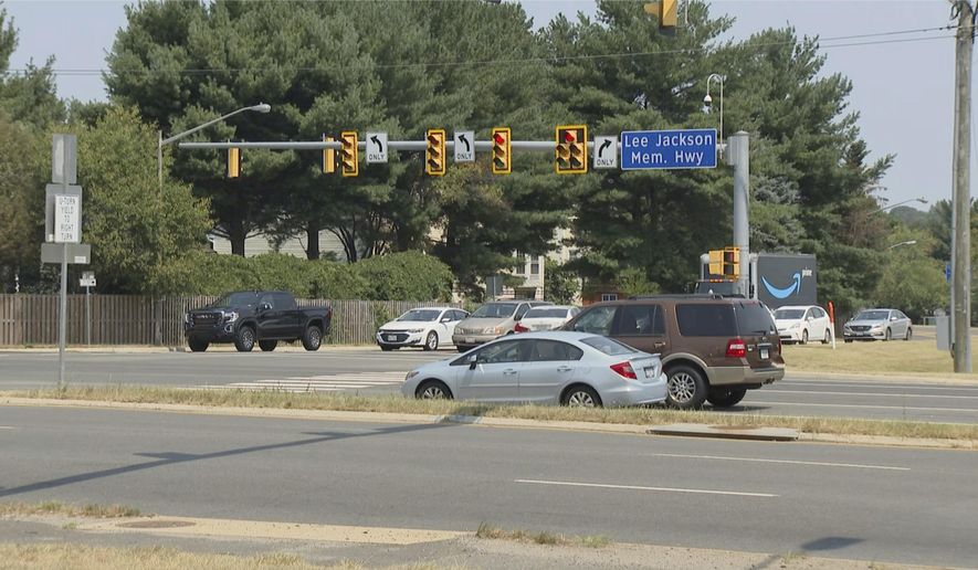This Monday, July 26, 2021, photo shows a sign for the Lee Jackson Highway in Fairfax County, Va. The names of Confederate leaders are being stripped from schools and major highways throughout Virginia. But when it comes to the many side streets in the state that carry Confederate names, it's a different story. (AP Photo/Dan Huff)