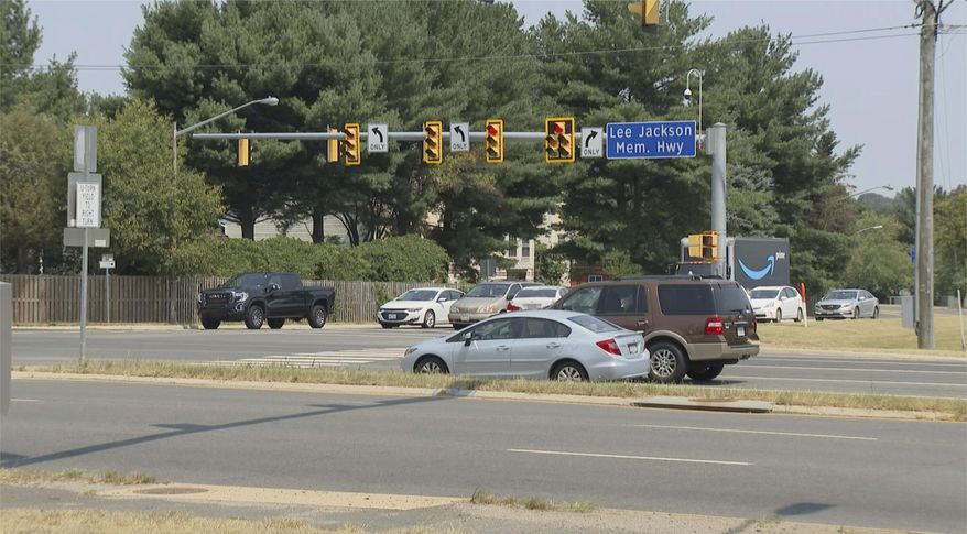 This Monday, July 26, 2021, photo shows a sign for the Lee Jackson Highway in Fairfax County, Va. The names of Confederate leaders are being stripped from schools and major highways throughout Virginia. But when it comes to the many side streets in the state that carry Confederate names, it's a different story. (AP Photo/Dan Huff)