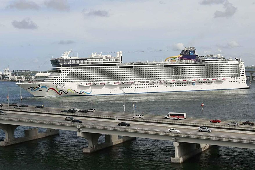 In this July 7, 2010, photo, the Norwegian Epic, owned by the Norwegian Cruise Line Corporation, sails through the Government Cut to the Port of Miami in Miami. A federal judge on Sunday night, Aug. 8, 2021, granted Norwegian Cruise Line’s request to temporarily block a Florida law banning cruise companies from asking passengers for proof of coronavirus vaccination before they board a ship. U.S. District Judge Kathleen Williams granted the preliminary injunction in a lawsuit challenging the state’s “vaccine passport” ban, which was signed into law in May by Republican Gov. Ron DeSantis.   (Pedro Portal/El Nuevo Herald via AP) **FILE**