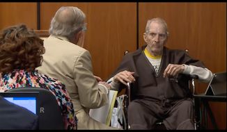 In this still image taken from the Law &amp;amp; Crime Network court video, real estate heir Robert Durst, right, describes what ailments he has to defense attorney Dick Deguerin during his murder trial on Monday, Aug. 9, 2021, in Los Angeles County Superior Court in Inglewood, Calif. (Law &amp;amp; Crime Network via AP, Pool)