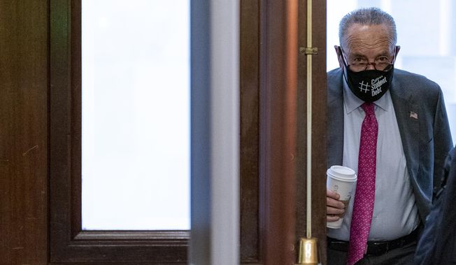 Senate Majority Leader Chuck Schumer of N.Y. arrives as the $1 trillion bipartisan infrastructure package is expected to be voted on by the Senate this morning on Capitol Hill in Washington, Tuesday, Aug. 10, 2021. (AP Photo/Andrew Harnik)