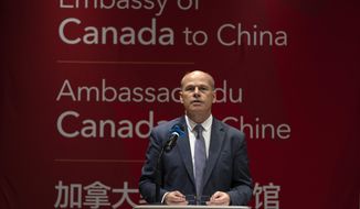 Jim Nickel, the deputy chief of mission for the Canadian Embassy in China, speaks at an event held in connection with the announcement of the sentence for Canadian citizen Michael Spavor at the Canadian Embassy in Beijing, Wednesday, Aug. 11, 2021. A Chinese court has sentenced Canadian Michael Spavor to 11 years on spying charges in case linked to Huawei. (AP Photo/Mark Schiefelbein)