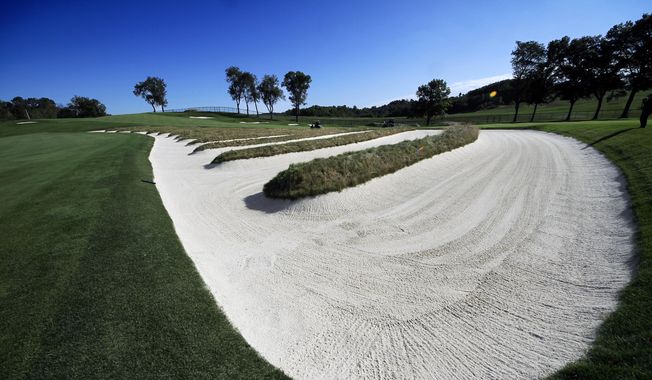 The Church Pews bunker on the fairway of the third hole at Oakmont Country Club in Oakmont, Pa., is shown in a Sept. 21, 2015, file photo. The course in Oakmont, Pa., already has hosted a record nine U.S. Opens. It now will be an anchor site for U.S. Opens and will host three more through 2049. (AP Photo/Gene J. Puskar, File)