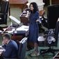 Texas State Sen. Carol Alvarado, D-Houston, wears running shoes as she filibusters Senate Bill 1, a voting bill, at the Texas Capitol Wednesday, Aug. 11, 2021, in Austin, Texas. (AP Photo/Eric Gay)