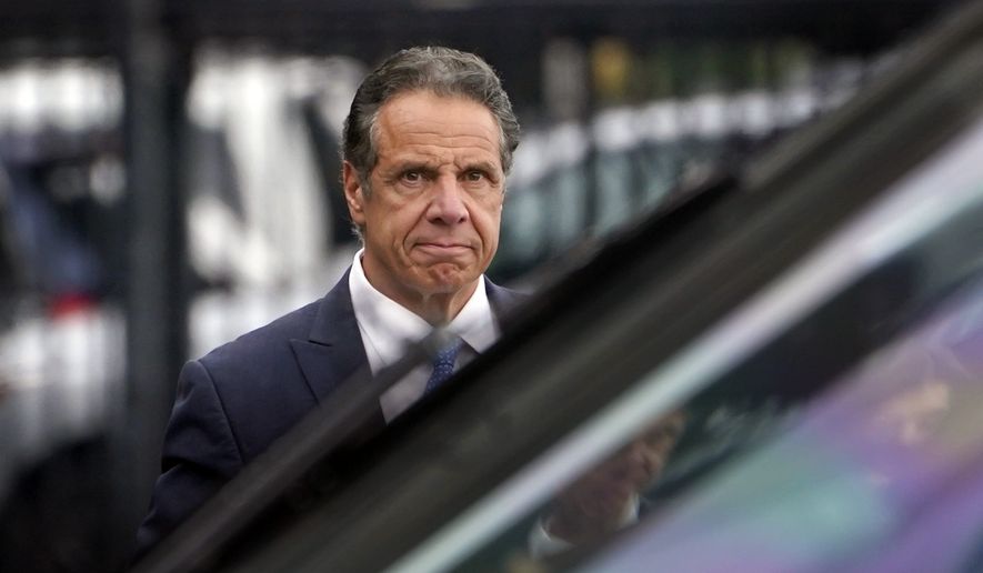 In this Tuesday, Aug. 10, 2021, file photo, New York Gov. Andrew Cuomo prepares to board a helicopter after announcing his resignation in New York. Sexual harassment allegations cost Cuomo his job. Now, many want to see him answer for a scandal that cut to the heart of his reputation as a pandemic hero and had life-and-death consequences — his handling of outbreaks in nursing homes. (AP Photo/Seth Wenig, File)