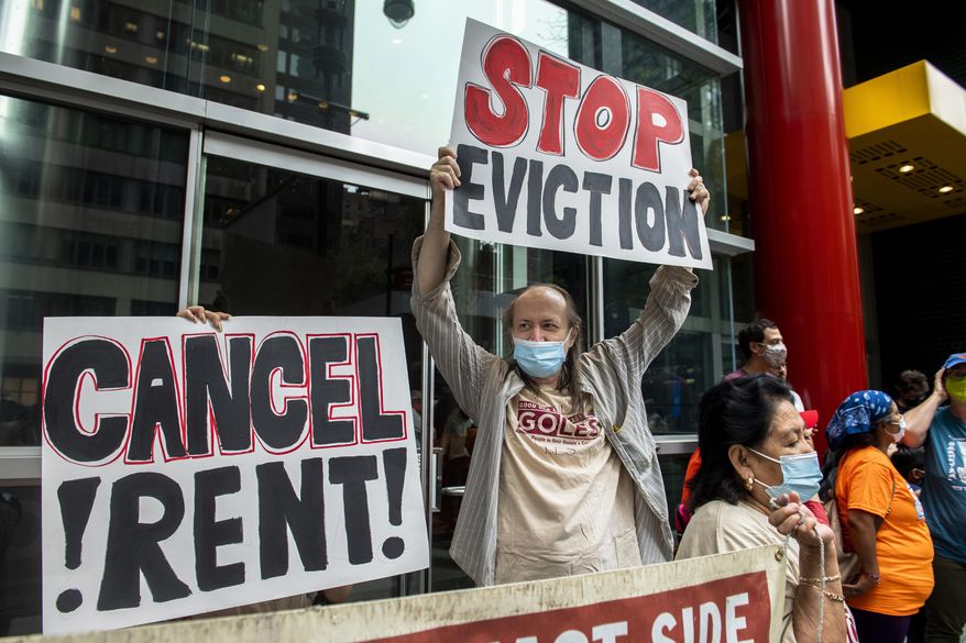In this Aug. 4, 2021, photo, housing advocates protest outside Gov. Andrew Cuomo's office on the eviction moratorium in New York. The Supreme Court is blocking part of New York's moratorium on evictions, put into effect because of the coronavirus pandemic, less than a month before it is supposed to expire anyway. (AP Photo/Brittainy Newman) **FILE**