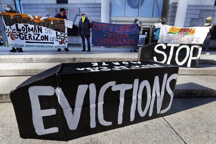 In this Jan. 13, 2021, file photo, tenants' rights advocates demonstrate in front of the Edward W. Brooke Courthouse in Boston. A federal judge is refusing landlords' request to put the Biden administrations new eviction moratorium on hold, though she made clear she thinks it's illegal. U.S. District Judge Dabney Friedrich on Friday, Aug. 13, said her hands are tied by an appellate ruling the last time courts considered the evictions moratorium in the spring. (AP Photo/Michael Dwyer, File) **FILE**