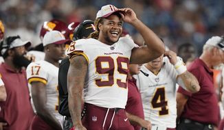 Washington Football Team defensive end Chase Young (99) during the second half of a preseason NFL football game, Thursday, Aug. 12, 2021, in Foxborough, Mass. (AP Photo/Steven Senne)