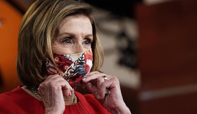 House Speaker Nancy Pelosi of Calif., puts her mask back on after a news conference on Capitol Hill in Washington, Thursday, May 13, 2021. (AP Photo/Susan Walsh)