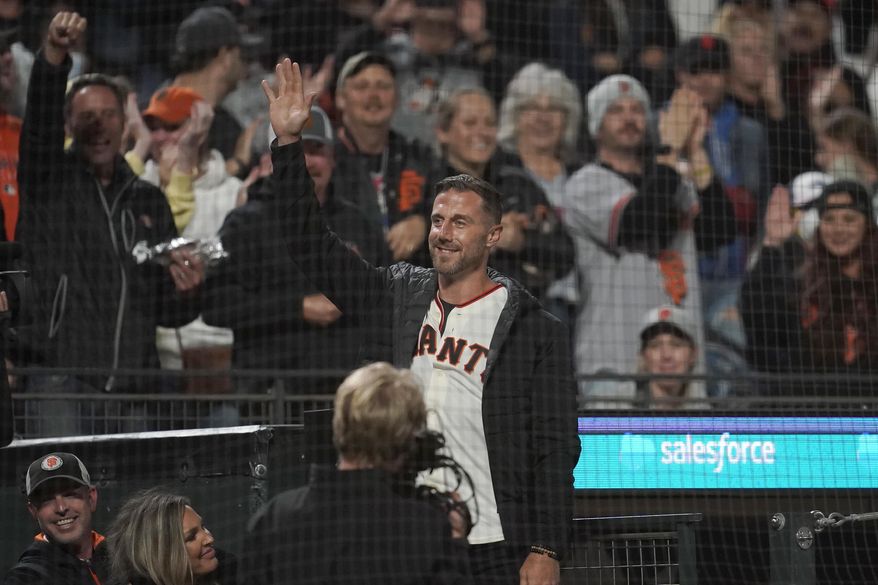 Former NFL quarterback Alex Smith waves to fans while being introduced during a baseball game between the San Francisco Giants and the Colorado Rockies in San Francisco, Friday, Aug. 13, 2021. (AP Photo/Jeff Chiu) ** FILE **