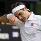 In this July 7, 2021, file photo, Switzerland&#39;s Roger Federer wipes his brow during the men&#39;s singles quarterfinals match against Poland&#39;s Hubert Hurkacz on day nine of the Wimbledon Tennis Championships in London. Federer pulled out of the upcoming hard-court tournaments in Toronto and Cincinnati on Thursday, Aug. 5, 2021, citing lingering issues with his surgically repaired knee and shedding doubt on his status for the U.S. Open. (AP Photo/Kirsty Wigglesworth, File) **FILE**