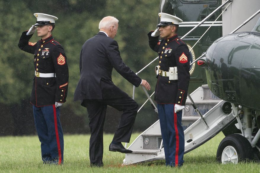 President Joe Biden boards Marine One as he leaves Fort Lesley J. McNair in Washington, Monday, Aug. 16, 2021, en route to Camp David after addressing the nation from the White House about Afghanistan. (AP Photo/Manuel Balce Ceneta)