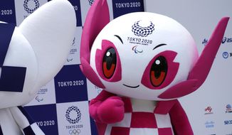 FILE - In this July 22, 2018, file photo, Tokyo 2020 Paralympic mascot &amp;quot;Someity&amp;quot; stands at stage during their debut event in Tokyo. Tokyo organizers said Monday, Aug. 16, 2021, what everyone expected: fans will be barred from the Paralympic Games during the pandemic, as they were from the just-completed Tokyo Olympics.(AP Photo/Eugene Hoshiko, File)