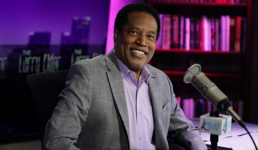 In this July 12, 2021 file photo, radio talk show host Larry Elder poses for a photo in his studio in Burbank, Calif. Elder, the leading Republican candidate in the California recall election that could remove Democratic Gov. Gavin Newsom from office, reported income of over $100,000 in the last year from business interests that included media and film companies and a string of speeches to Republican and conservative groups, documents showed Tuesday, Aug. 17, 2021. (AP Photo/Marcio Jose Sanchez, File)