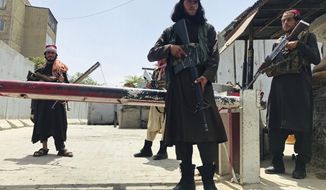 Taliban fighters stand guard at a checkpoint near the US embassy that was previously manned by American troops, in Kabul, Afghanistan, Tuesday, Aug. 17, 2021. The Taliban declared an &amp;quot;amnesty&amp;quot; across Afghanistan and urged women to join their government Tuesday, seeking to convince a wary population that they have changed a day after deadly chaos gripped the main airport as desperate crowds tried to flee the country. (AP Photo)