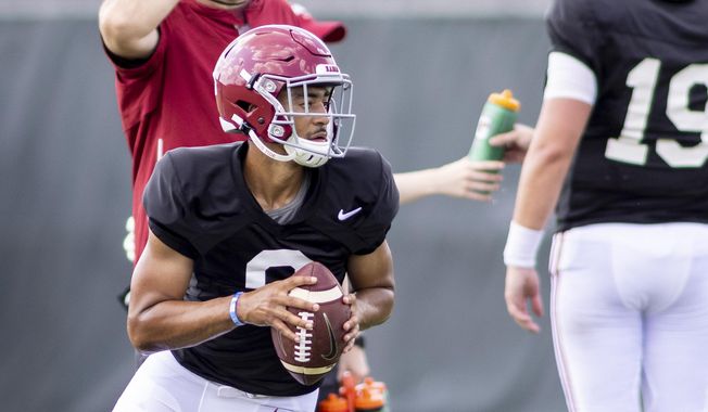 Alabama quarterback Bryce Young (9) rolls out on a passing drill during the NCAA college football team&#x27;s practice Thursday, Aug. 12, 2021, in Tuscaloosa, Ala. (AP Photo/Vasha Hunt) **FILE**