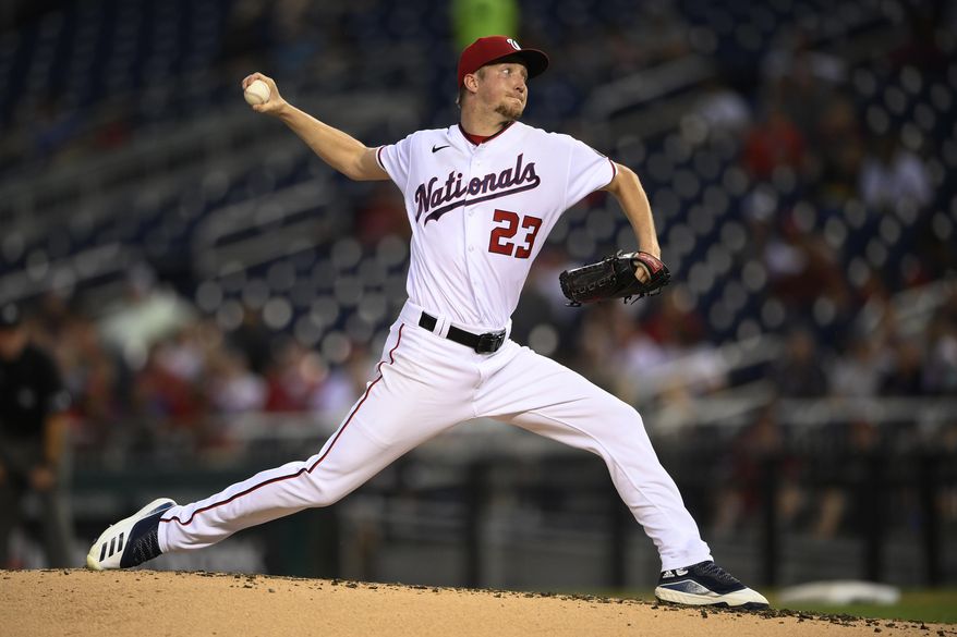 Washington Nationals starting pitcher Erick Fedde (23) delivers during the third inning of a baseball game against the Toronto Blue Jays, Tuesday, Aug. 17, 2021, in Washington. (AP Photo/Nick Wass)