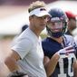 Mississippi football coach Lane Kiffin, left, and wide receiver John Rhys Plumlee (10) look at the camera during a morning NCAA college football practice on the Oxford, Miss., campus, Monday, Aug. 9, 2021. (AP Photo/Rogelio V. Solis)