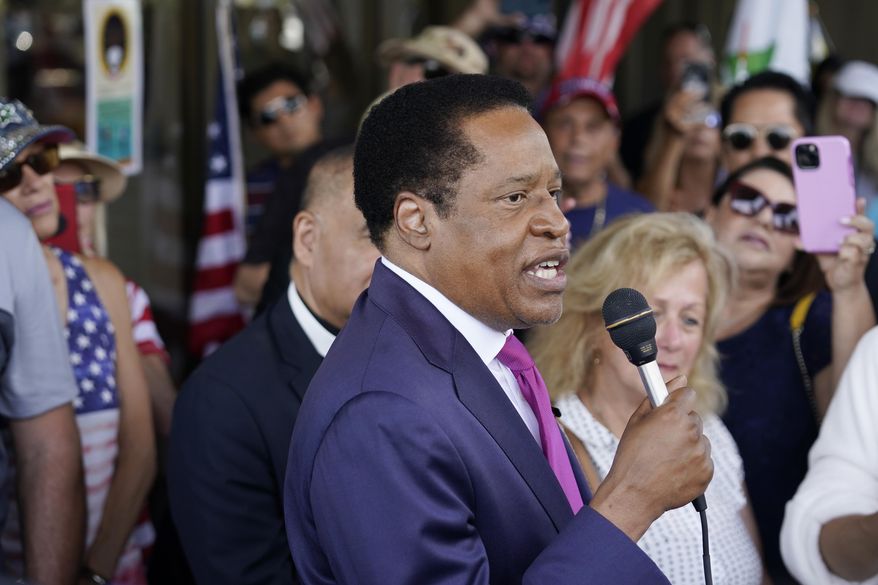 In this July 13, 2021, file photo, conservative radio talk show host Larry Elder speaks to supporters during a campaign stop in Norwalk, Calif. Elder doubled down on his past comments that employers should be able to ask women if and when they plan to get pregnant in a news conference on Wednesday, Aug. 18, 2021. Republican rival Kevin Faulconer criticized those comments and said they do not represent California's values. Faulconer continued the criticism in a Wednesday, Aug. 18 interview with The Associated Press. (AP Photo/Marcio Jose Sanchez, File)