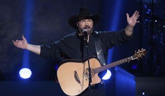 In this March 4, 2020, file photo, country star Garth Brooks performs on stage during the 2020 Gershwin Prize Honoree&#39;s Tribute Concert at the DAR Constitution Hall in Washington. (Photo by Brent N. Clarke/Invision/AP, File)