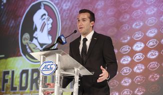FILE - Florida State quarterback McKenzie Milton answers a question during an NCAA college football news conference at the Atlantic Coast Conference media days in Charlotte, N.C., in this Thursday, July 22, 2021, file photo. Milton, who won his last 24 starts at UCF, now is attempting a comeback with Florida State and competing with Jordan Travis for the right to open the season as the Seminoles’ starting quarterback.(AP Photo/Nell Redmond, File) **FILE**
